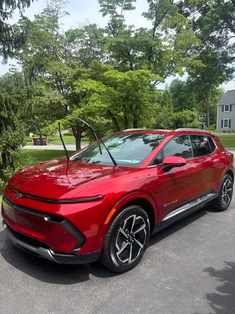 Red SUV detailed and drying in the sun