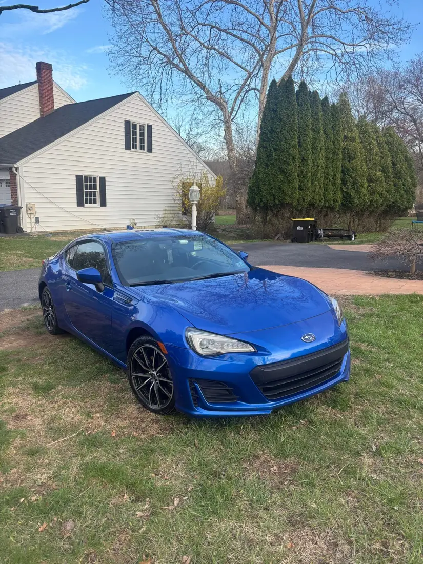 Blue Subaru BRZ with freshly washed and dressed wheels